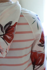 Hood and sleeve detail on floral sweatshirt.